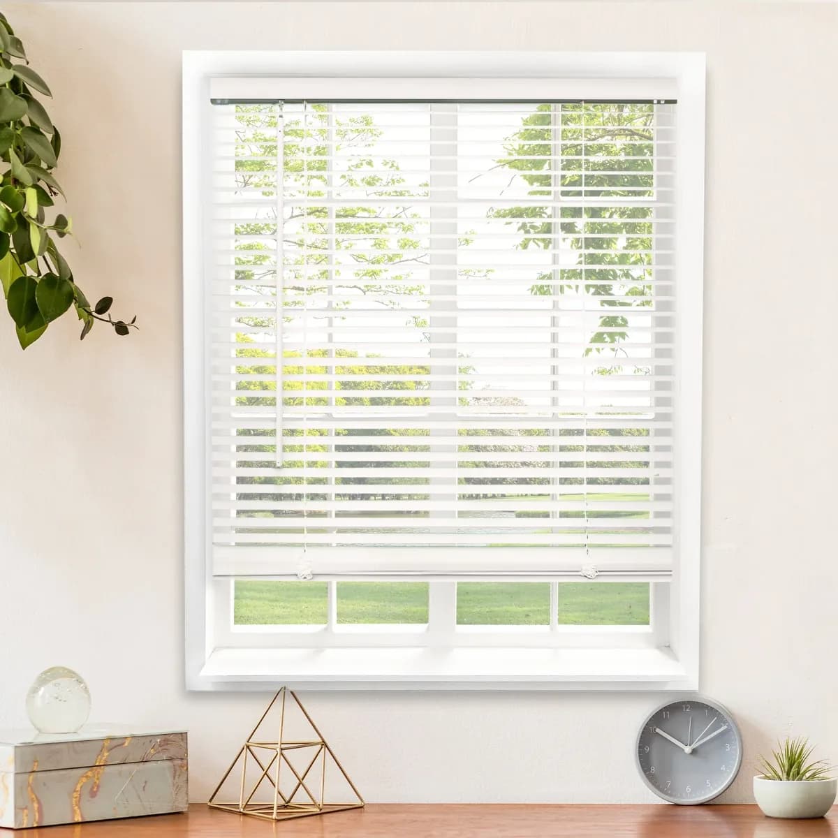 White faux wood blinds in a bright living room
